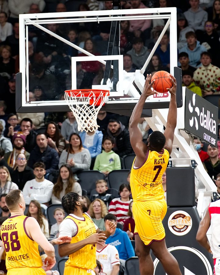 Fans courtside at an NBA game
